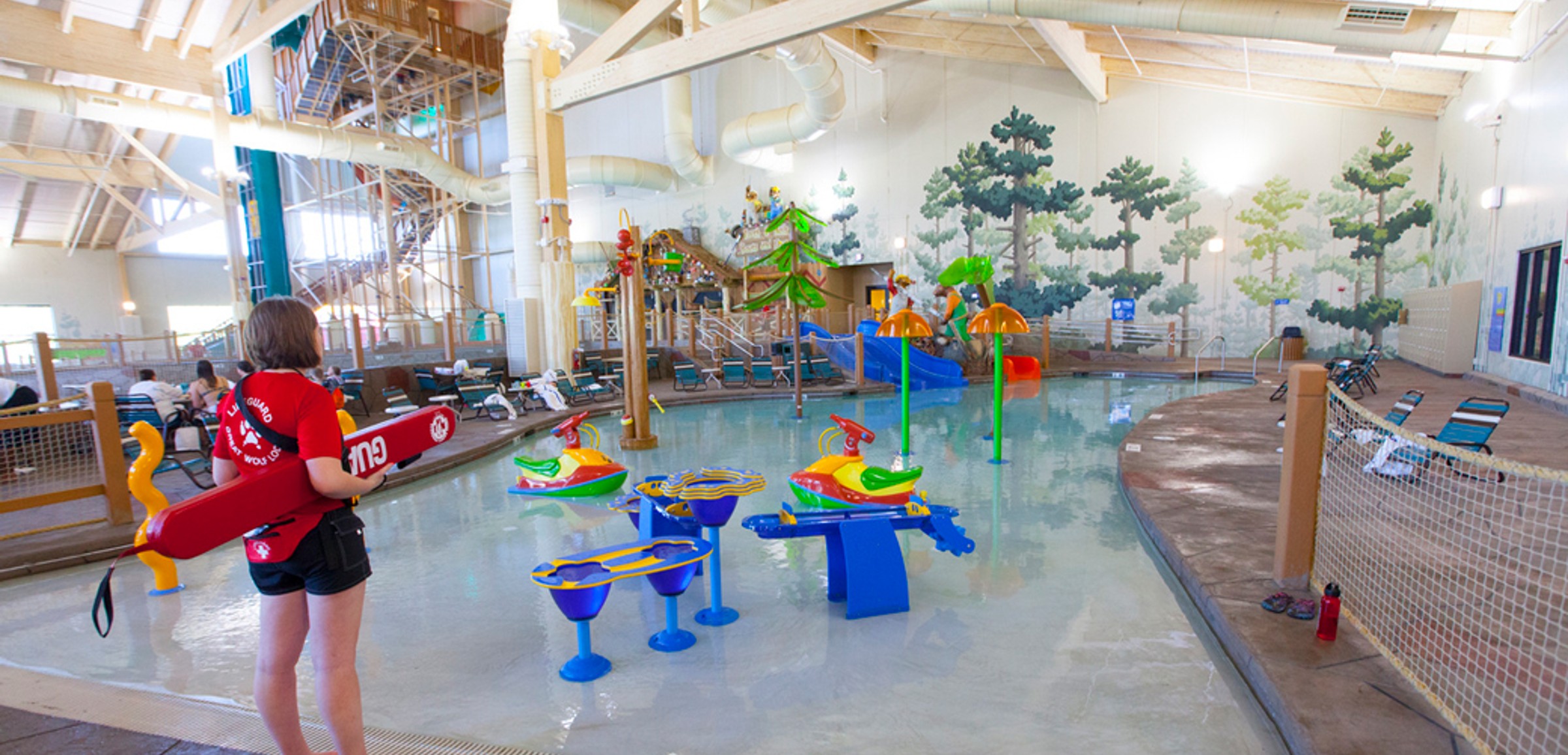 Little girl enjoying cub paw pool