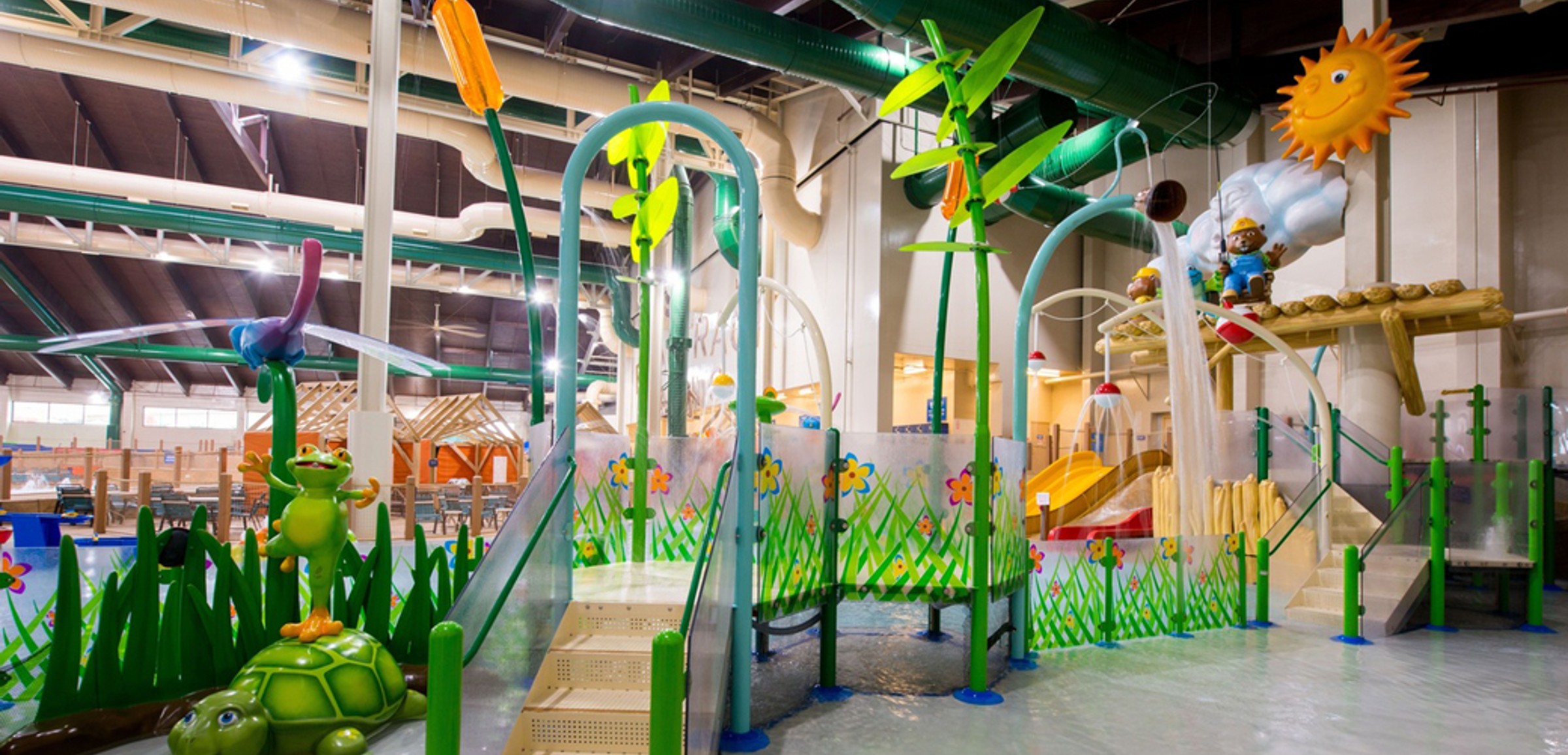 Little girl enjoying cub paw pool