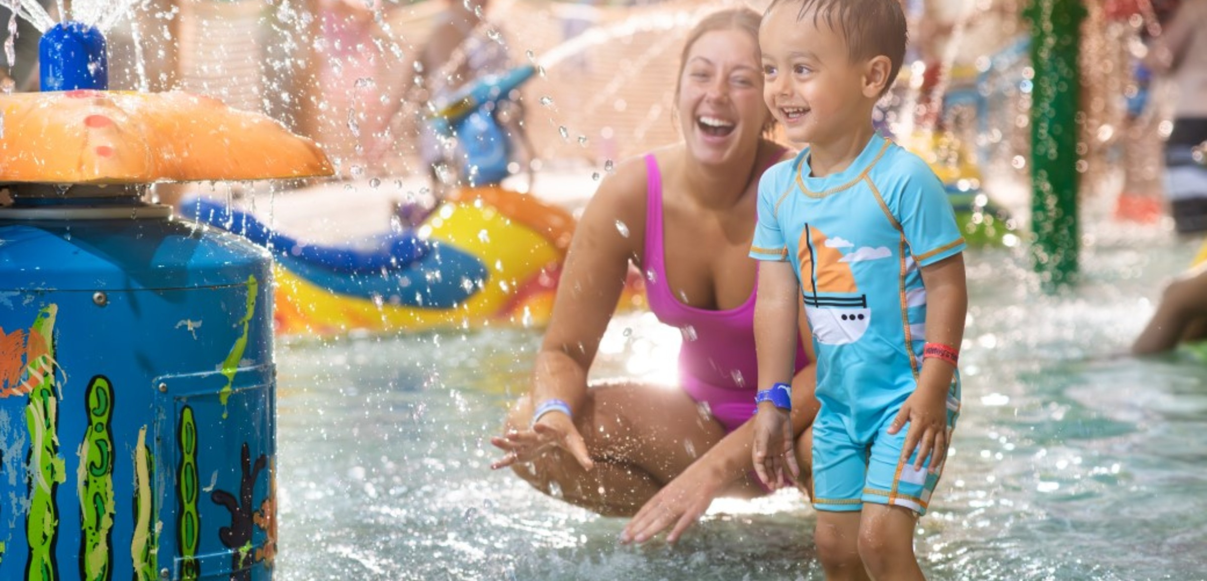mother and child enjoying in a kidee pool in waterpark