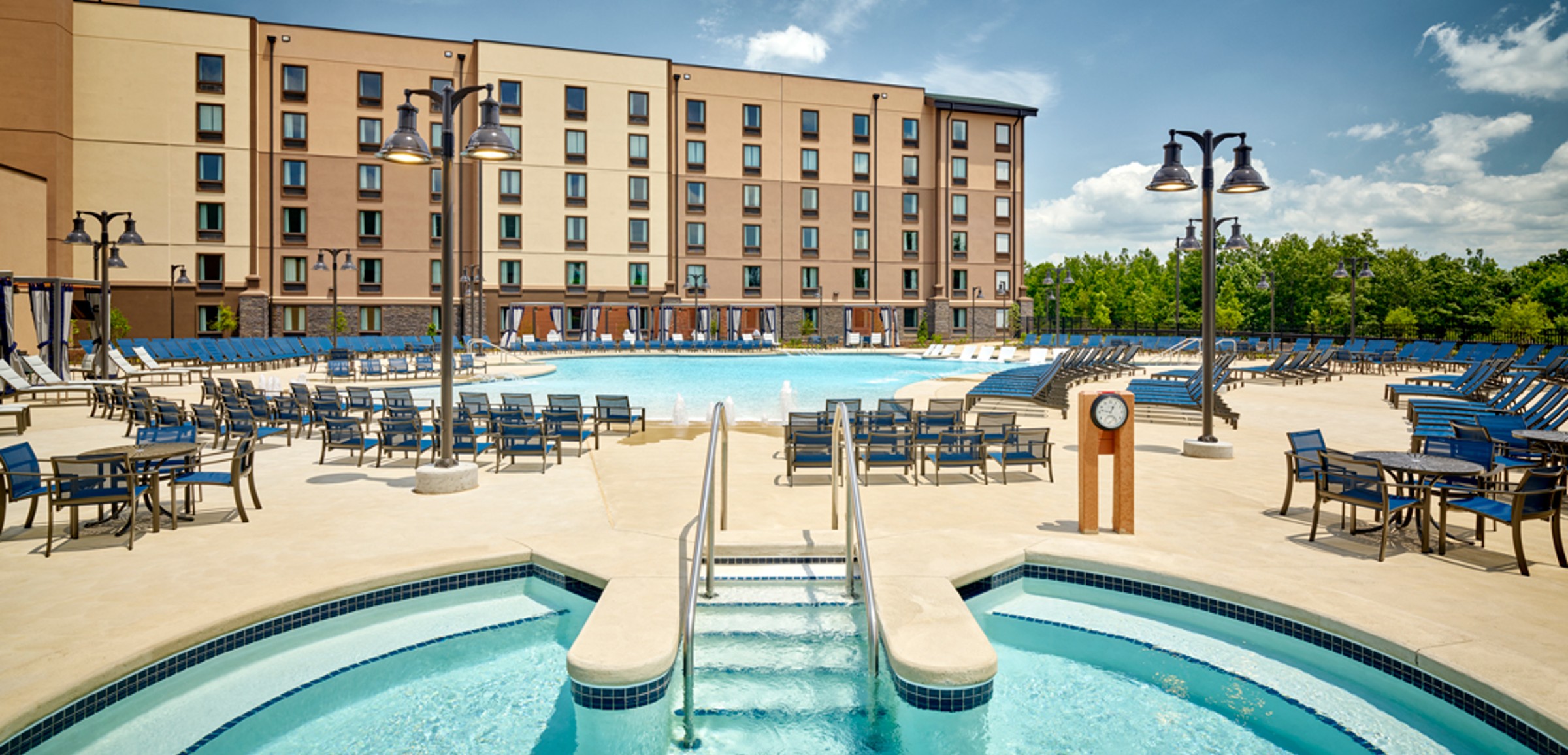 A family of four relaxes in the indoor pool