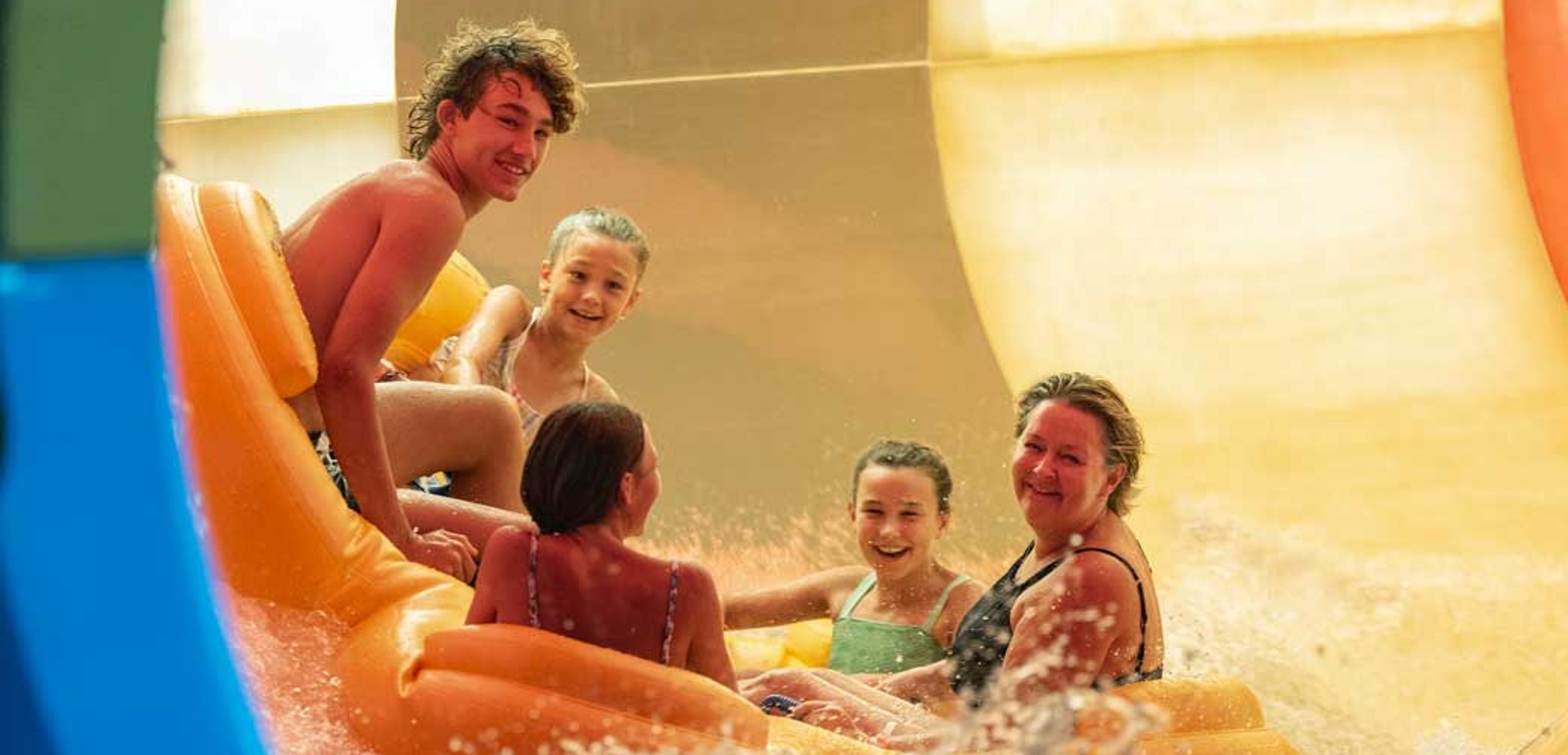 Family of five rides down enclosed waterslide 