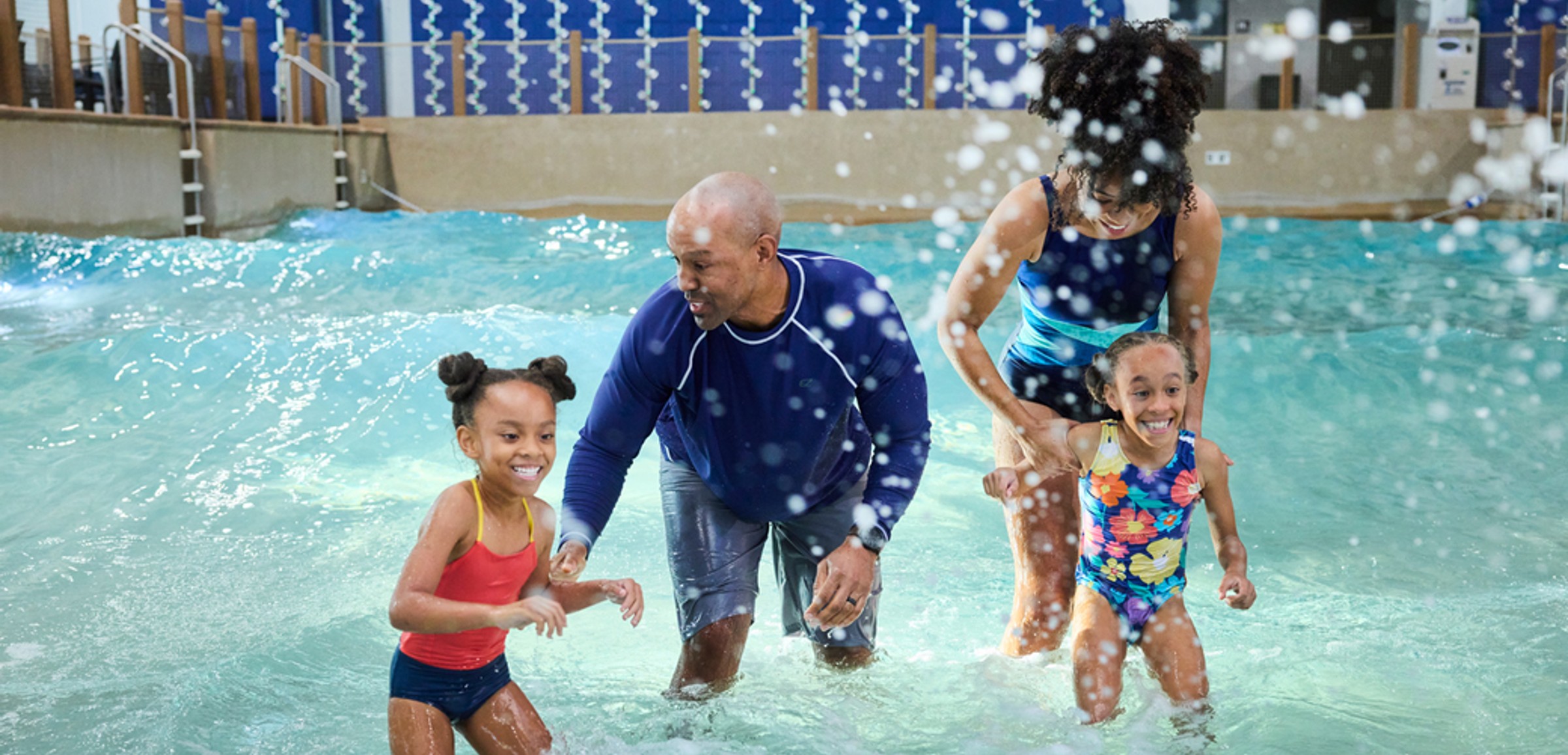Family of 4 enjoying the waterpark attractions