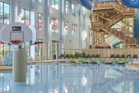A large indoor pool equipped with a colorful water slide