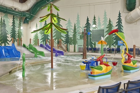 Vibrant water park featuring colorful slides and play areas designed for children.