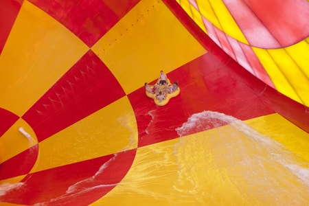 4 people on a 4-person tube riding dwn the howlin' tornado water park ride