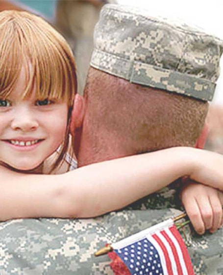 military holding his daughter
