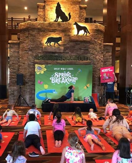 kids attending a yoga class in the resort lobby