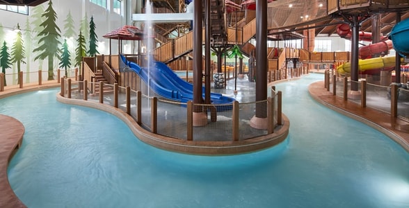 Family riding tubes enjoying the lazy river attraction