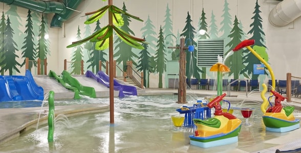 Vibrant water park featuring colorful slides and play areas designed for children.