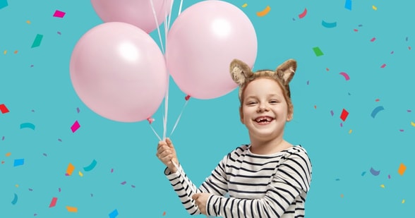 Girl with balloons during the birthday party
