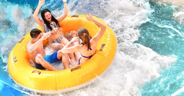 teens on a water park slide