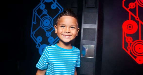 child smiling in Laser Tag area