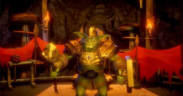 The Goblin King dressed in armor and holding a staff.