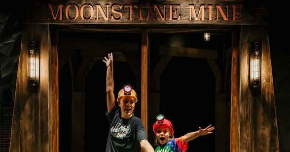 kids playing in the mirror maze