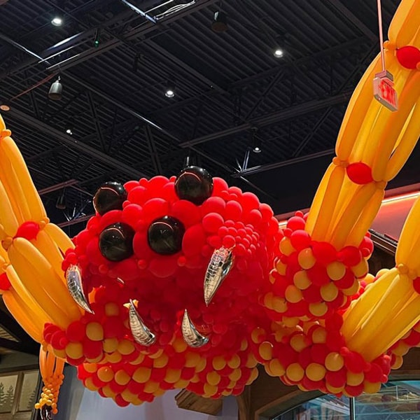spider made of orange balloons