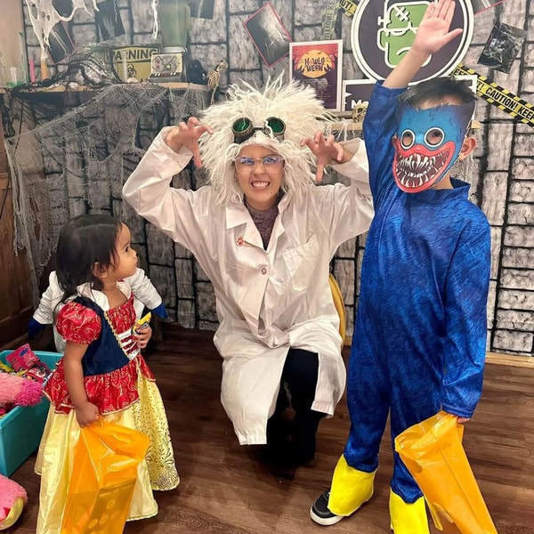 mom and kids in halloween costumes