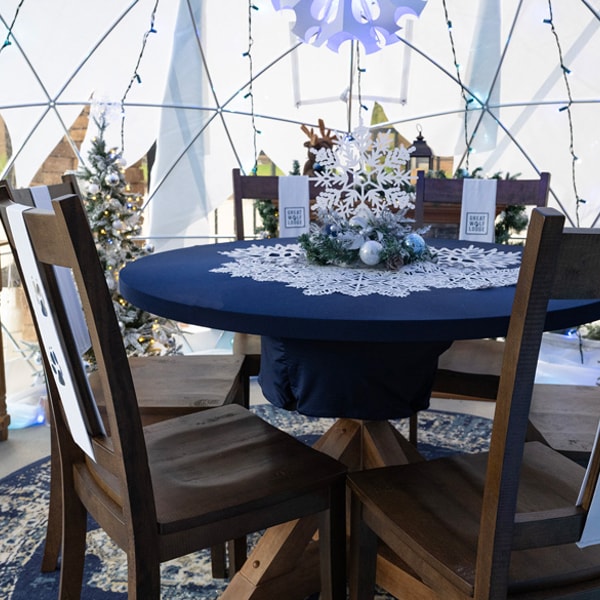 chairs and table set up in a snow globe