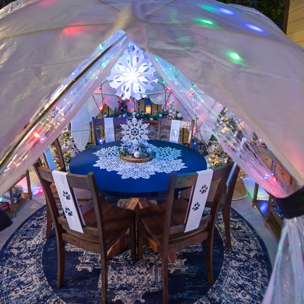 table and chairs in a snow globe