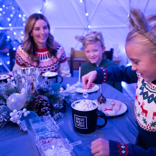 family decorating holiday cookies