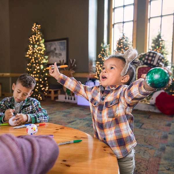 young kids making snowglobe crafts