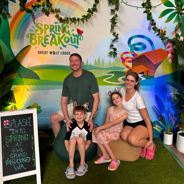 Family posing with SBO banner