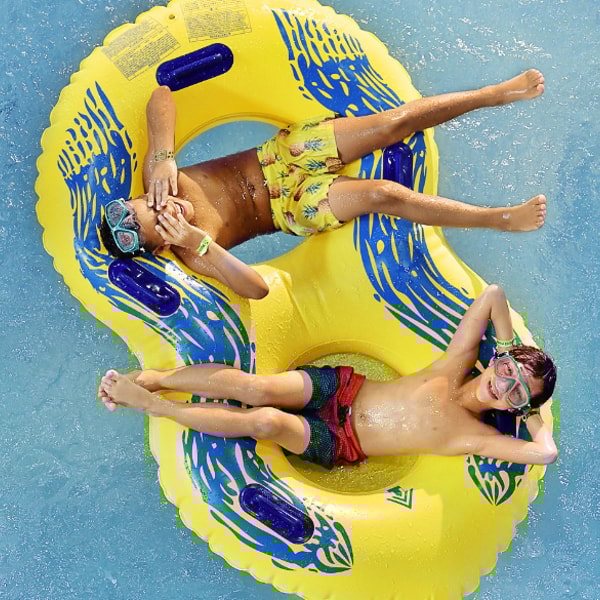 two kids on a raft slide