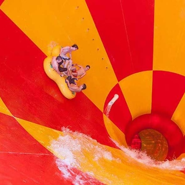 family going down a water slide