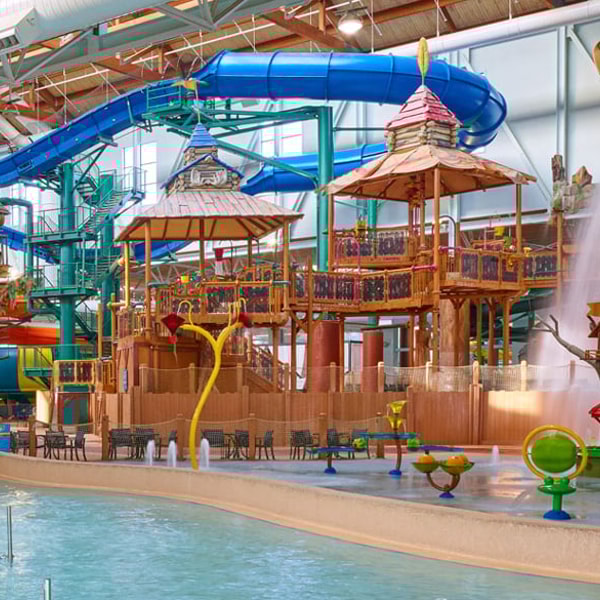 family riding a body slide