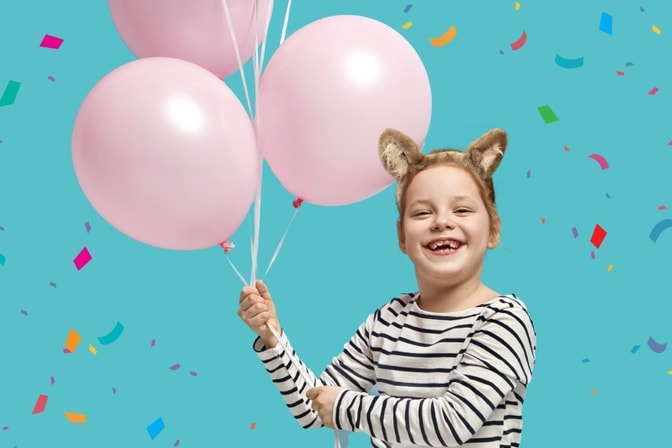 Girl with balloons during the birthday party