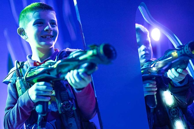 teenagers playing laser trail game