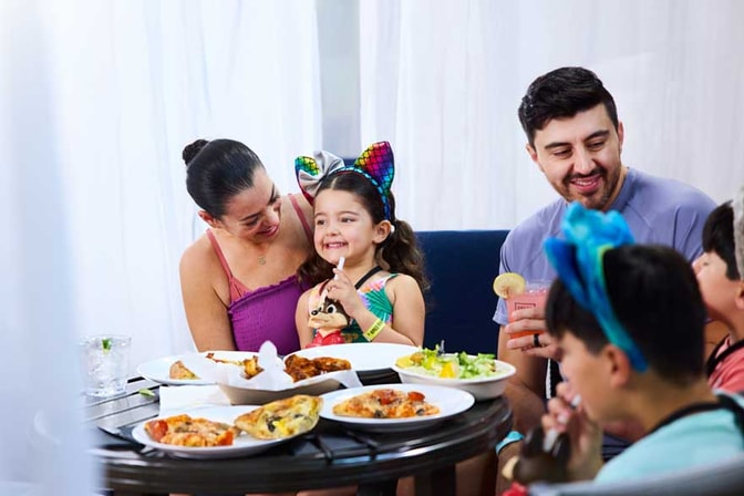family enjoying food inside a cabana