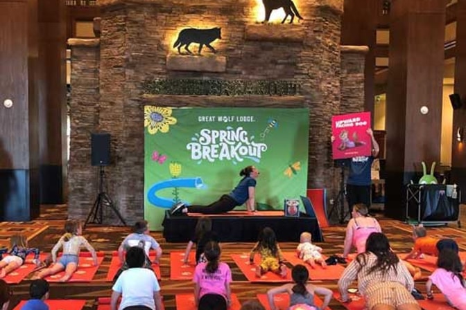 kids attending a yoga class in the resort lobby
