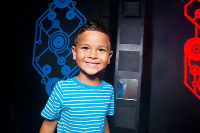 child smiling in Laser Tag area