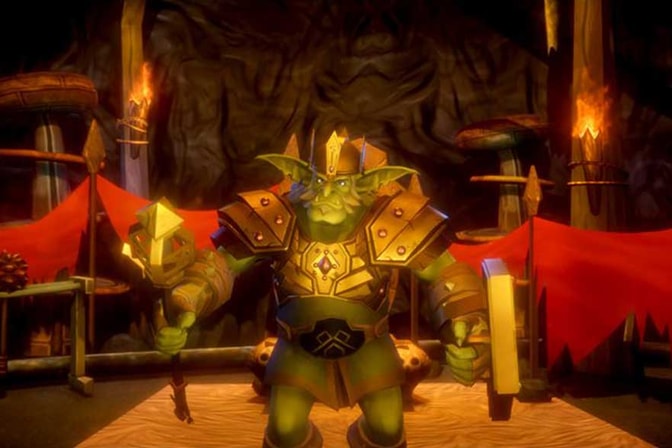 The Goblin King dressed in armor and holding a staff.