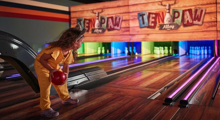 Girl enjoying at Ten Paw Alley at Great Wolf Lodge indoor water park and resort.