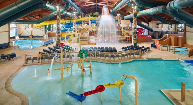 mother and child enjoying in a kidee pool in waterpark