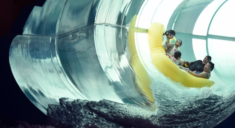 Family of five rides down enclosed waterslide 