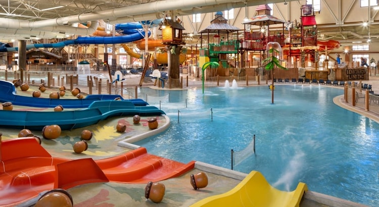 kid rides down waterslide