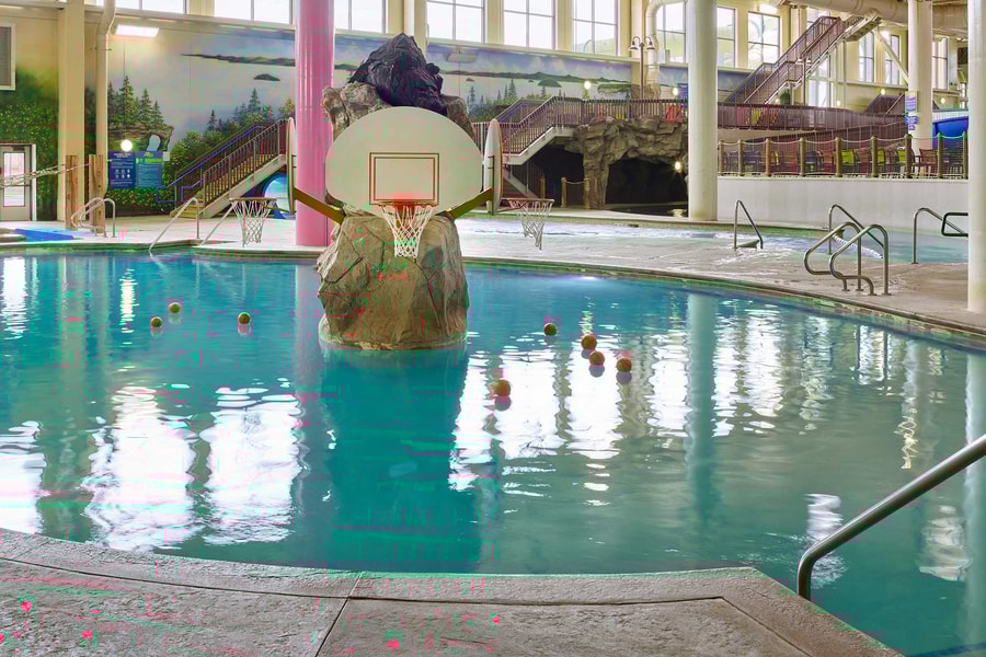 basketball hoop and balls in an indoor sports pool