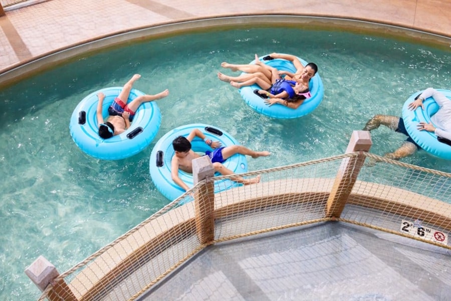 A girl smiling while on her tube at crooked creek
