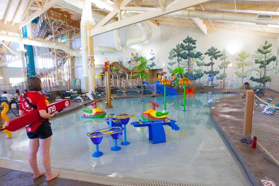 mother and child enjoying in a kidee pool in waterpark