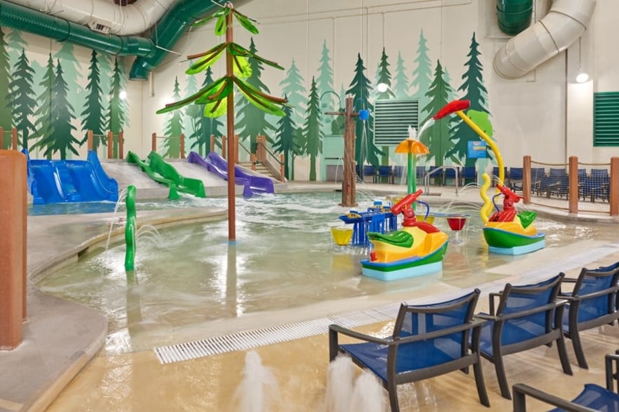 mother and child enjoying in a kidee pool in waterpark