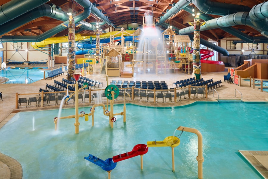 mother and child enjoying in a kidee pool in waterpark