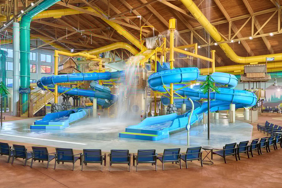 A wide shot of the water treehouse as water splashes down from a bucket