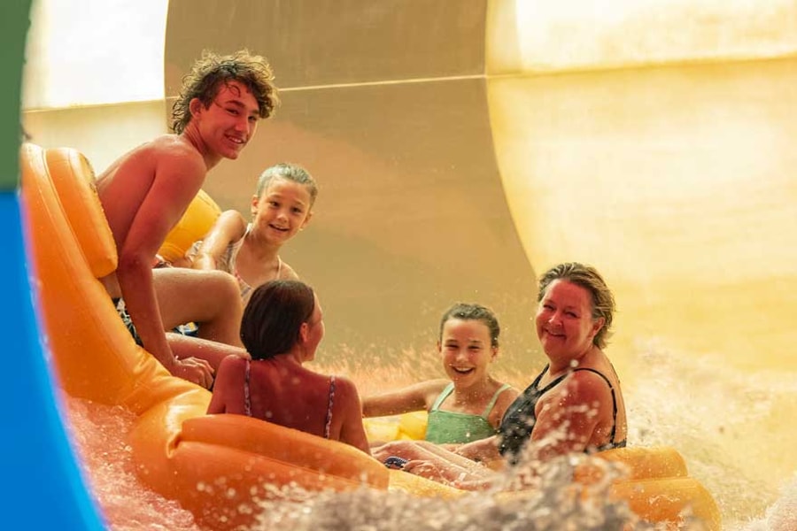 Family of five rides down enclosed waterslide 