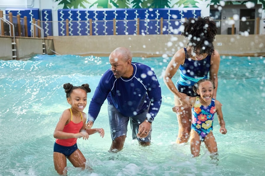 Family of 4 enjoying the waterpark attractions