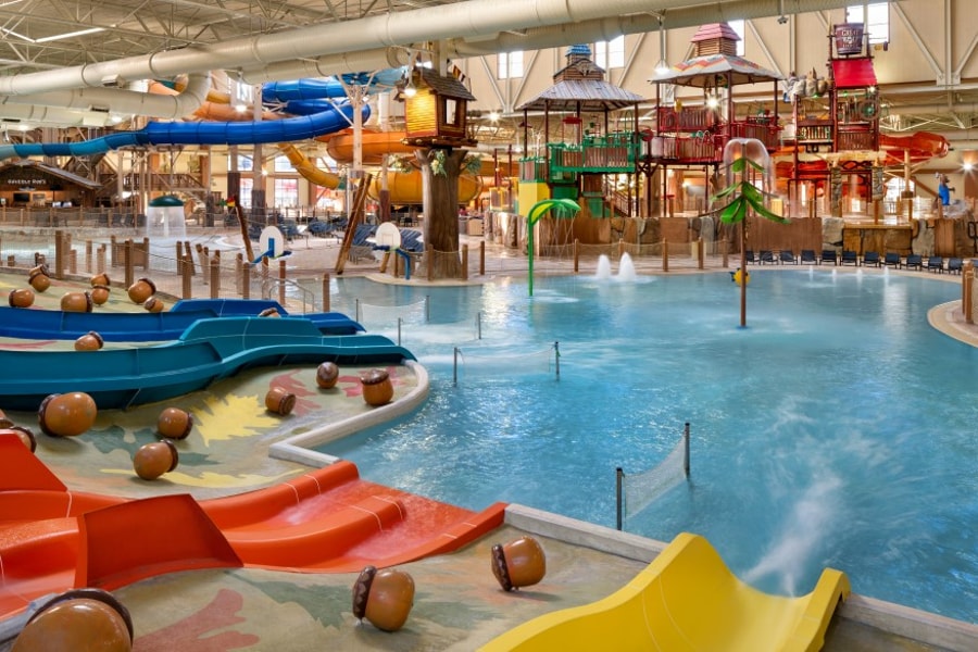 kid rides down waterslide