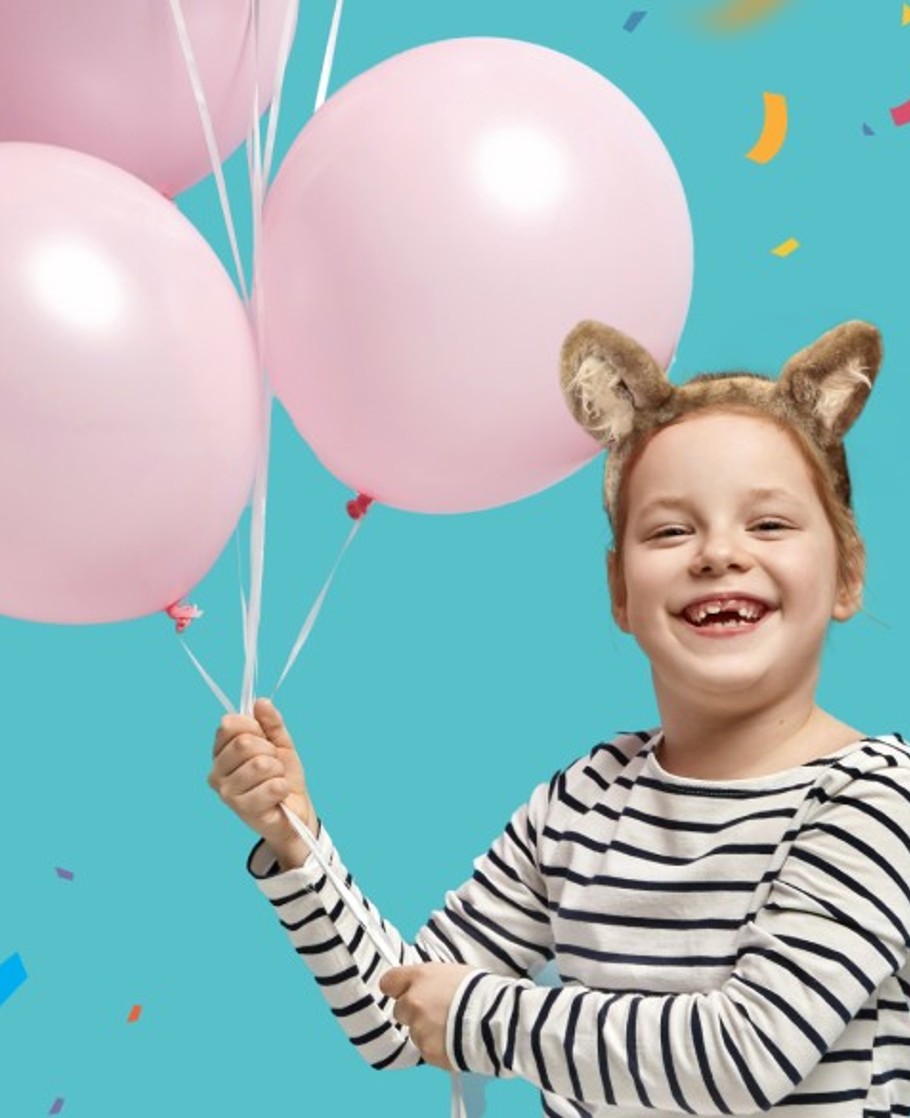 Girl with ballons at birthday party at Great Wolf Lodge