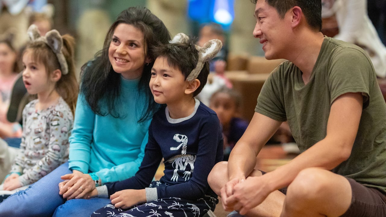 family sitting together as kids wear the wolf ears