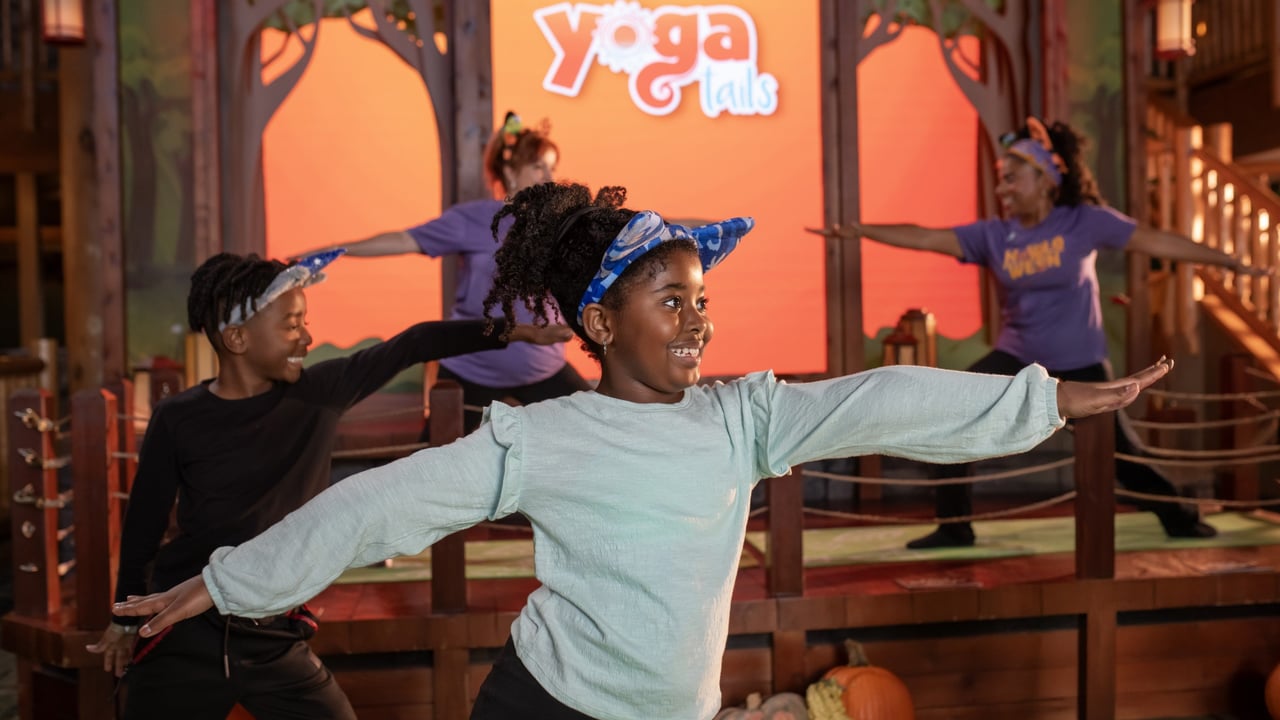 Kids practicing playful yoga poses at Great Wolf Lodge event